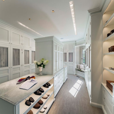 Large elegant gender-neutral carpeted and brown floor walk-in closet photo in Other with recessed-panel cabinets and white cabinets