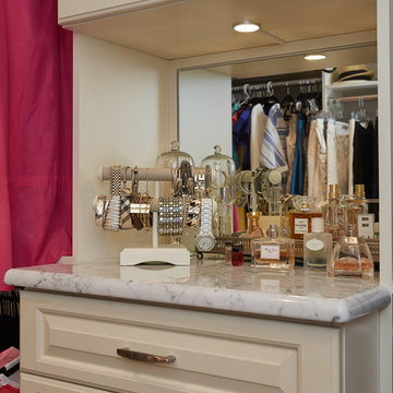 Traditional highly-functional custom women's walk-in closet