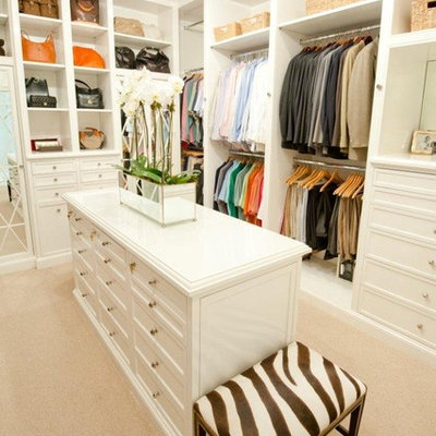 Inspiration for a timeless walk-in closet remodel in Houston with white cabinets