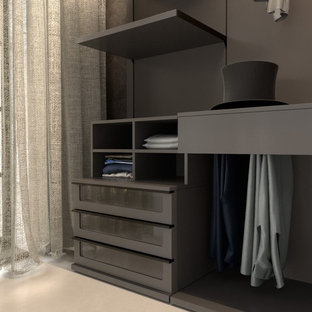 Modelo de armario vestidor unisex, moderno, de tamaño medio, con armarios abiertos, puertas de armario negras, moqueta y suelo beige