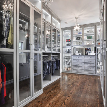 Walk-in Closet Featuring Glass Inserted Doors And LED Lights