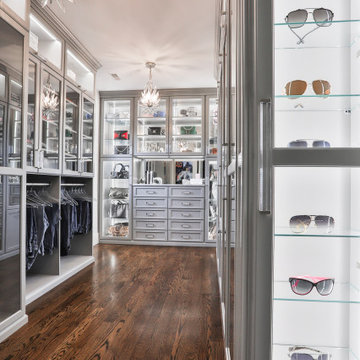 Walk-in Closet Featuring Glass Inserted Doors And LED Lights