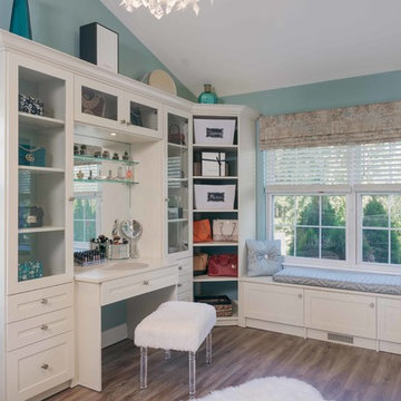 Walk-In Closet With Corner Shelves and Glass Doors