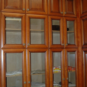 Walk-In Closet with Glass Cabinets