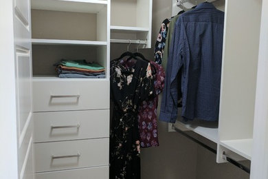 Mid-sized transitional carpeted walk-in closet photo in Edmonton with flat-panel cabinets and white cabinets