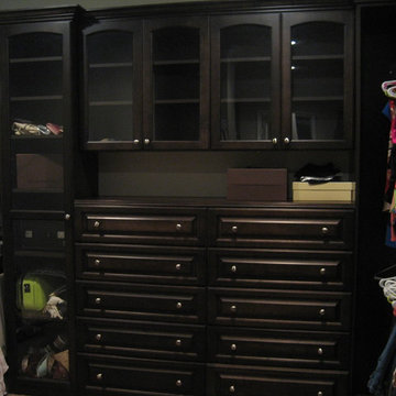 Walk-in Master Closet Chocolate Stained Wood Exteriors and Chocolate Melamine