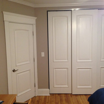 White Primed Solid Wood Closet and Sliding Doors with Raised Moulding