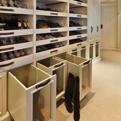 Large transitional gender-neutral carpeted dressing room photo in Boston with open cabinets and white cabinets
