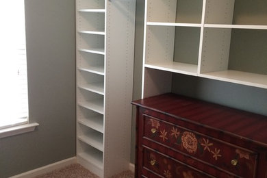 Walk-in closet - mid-sized traditional gender-neutral carpeted and beige floor walk-in closet idea in Atlanta with open cabinets and white cabinets