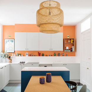 Mid-sized contemporary l-shaped eat-in kitchen in Madrid with a drop-in sink, flat-panel cabinets, grey cabinets, quartz benchtops, white splashback, stone slab splashback, stainless steel appliances, with island and ceramic floors.