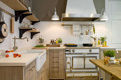 Example of a mid-sized farmhouse l-shaped eat-in kitchen design in Barcelona with flat-panel cabinets, medium tone wood cabinets, white backsplash and no island