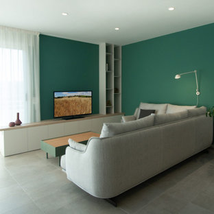 Idee per una sala da pranzo moderna chiusa e di medie dimensioni con pareti verdi, pavimento in gres porcellanato e pavimento grigio