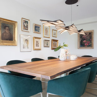 Imagen de comedor actual con paredes blancas