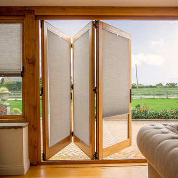 Bi-folding Doors with Duette® Pleated Blinds