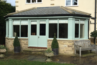 Design ideas for a traditional conservatory in Other with porcelain flooring.