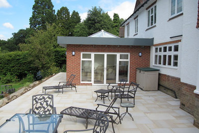 Medium sized contemporary patio in Kent.
