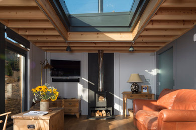 Inspiration for a medium sized traditional conservatory in Other with a wood burning stove.