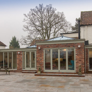 Large Orangery with multiple Lanterns, mutifold doors and link to garage
