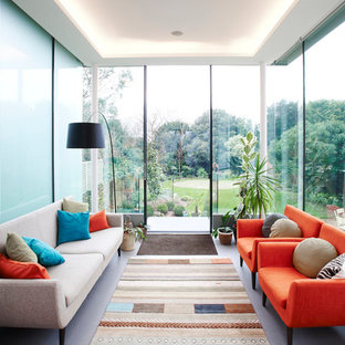 This is an example of a contemporary conservatory in Other with a standard ceiling and grey floors.