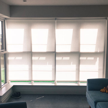 Scandinavian Inspired Sunroom Dim-Out Roller Blinds Lowered During Fittng
