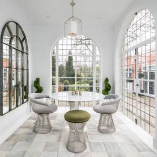 Design ideas for a large contemporary conservatory in London with white floors.