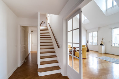 Inspiration for a huge transitional light wood floor hallway remodel in Paris with white walls