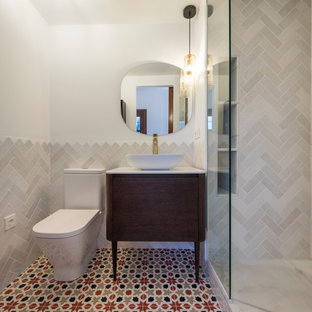 Inspiration for a small mediterranean master bathroom in Other with open cabinets, white cabinets, a corner shower, a two-piece toilet, white tile, ceramic tile, white walls, ceramic floors, a vessel sink, red floor and white benchtops.
