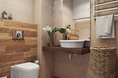 Modelo de cuarto de baño mediterráneo pequeño con sanitario de pared, aseo y ducha y lavabo sobreencimera
