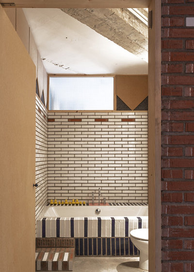 インダストリアル 浴室 by NOMOS Arquitectos