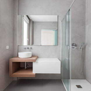 Inspiration for a mid-sized modern 3/4 bathroom in Madrid with flat-panel cabinets, white cabinets, a corner shower, grey walls, ceramic floors, a vessel sink, grey floor and a sliding shower screen.