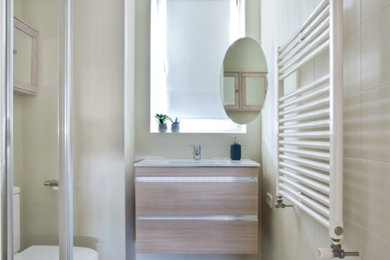 Photo of a small scandi ensuite bathroom in Other with a corner shower, a two-piece toilet, beige tiles, ceramic tiles, beige walls, ceramic flooring, a wall-mounted sink, multi-coloured floors and a sliding door.