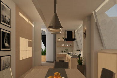 Imagen de cocina comedor minimalista con puertas de armario de madera clara, encimera de cuarcita y suelo de madera clara