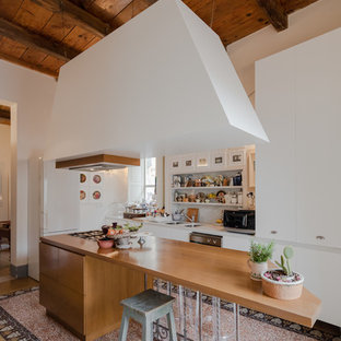 Inspiration for a mid-sized eclectic l-shaped open plan kitchen in Other with flat-panel cabinets, white cabinets, marble benchtops, grey splashback, marble splashback, marble floors, with island, multi-coloured floor, a double-bowl sink and white appliances.