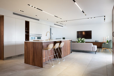 Esempio di una grande cucina minimal con ante lisce, elettrodomestici bianchi, pavimento grigio, top bianco e ante in legno scuro
