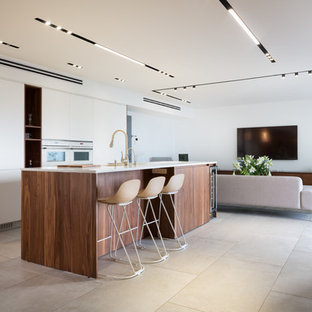 Esempio di una grande cucina minimal con ante lisce, elettrodomestici bianchi, pavimento grigio, top bianco e ante in legno scuro