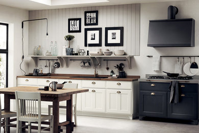Design ideas for a small vintage single-wall open plan kitchen in Other with a single-bowl sink, recessed-panel cabinets, white cabinets, laminate countertops, no island and brown worktops.