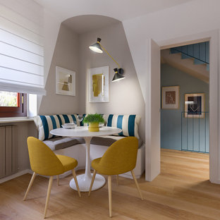 Mid-sized scandinavian l-shaped open plan kitchen in Milan with a single-bowl sink, flat-panel cabinets, white cabinets, quartz benchtops, beige splashback, stainless steel appliances, light hardwood floors, no island and beige benchtop.