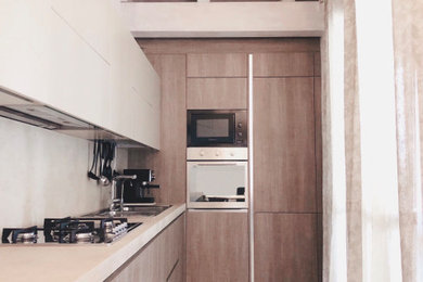 Foto di una cucina a L minimal