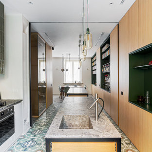 Large modern galley eat-in kitchen in Milan with an integrated sink, beaded inset cabinets, light wood cabinets, marble benchtops, stainless steel appliances, marble floors, multiple islands, multi-coloured floor and grey benchtop.