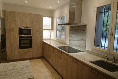 Design ideas for a contemporary enclosed kitchen in Nice with a single-bowl sink, beaded cabinets, beige cabinets, marble worktops, beige splashback, cement tile splashback, stainless steel appliances, cement flooring, an island and beige floors.