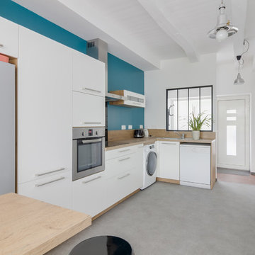 Extension verrière et surélévation d'une maison de ville mitoyenne