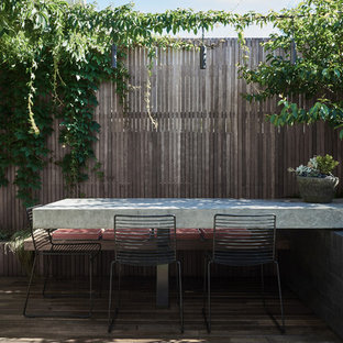 Photo of a contemporary backyard deck in Melbourne with no cover.