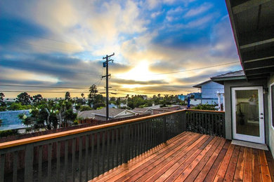 Example of a mid-sized classic backyard deck design in San Diego with no cover