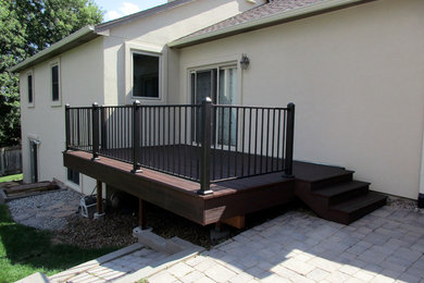 Example of a mid-sized backyard deck design in Denver
