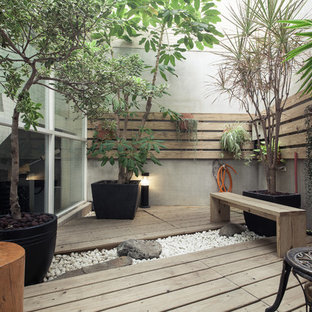 Small asian courtyard deck photo in Other with no cover