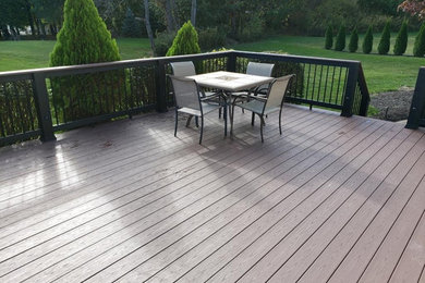 Inspiration for a large contemporary backyard deck remodel in Cleveland
