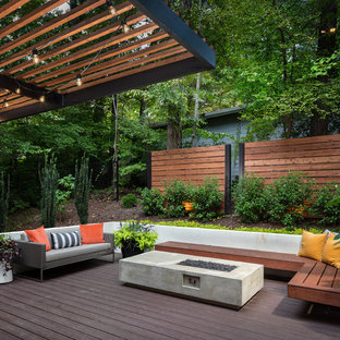 Inspiration for a large contemporary backyard deck remodel in Atlanta with a fire pit and a pergola
