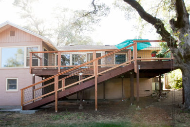 Example of a mid-sized arts and crafts deck design in Sacramento