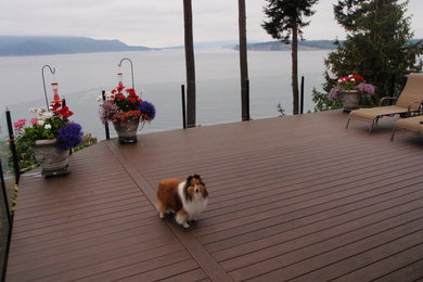 Inspiration for a huge modern backyard deck remodel in Seattle with no cover