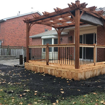 Backyard Patio and Ceadar Deck with Pergola and Water Feature